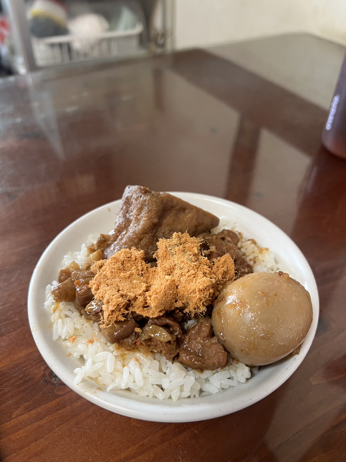 Pork Stewed Rice with Egg and dried pork meat on top